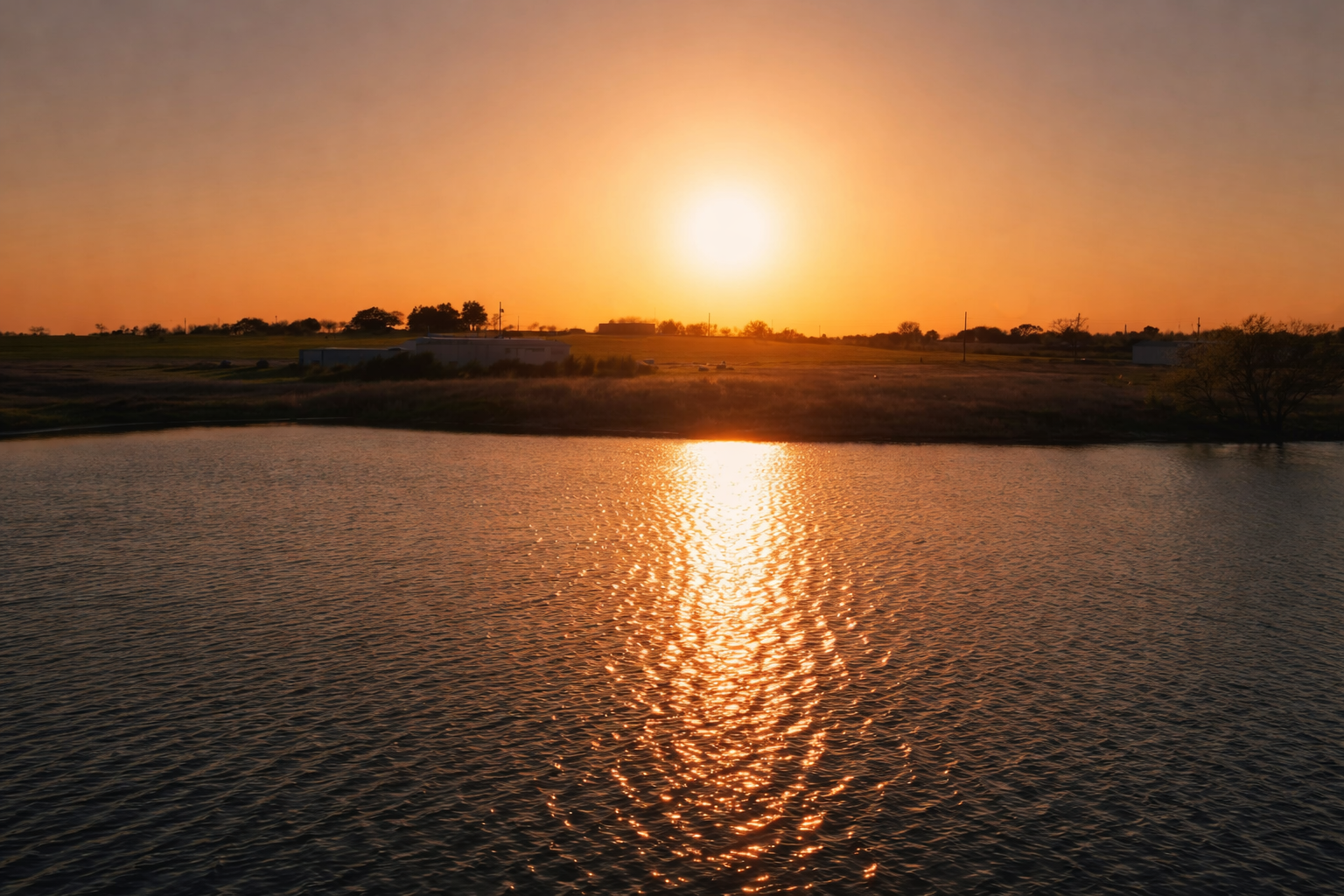 Golden sunset over serene lake