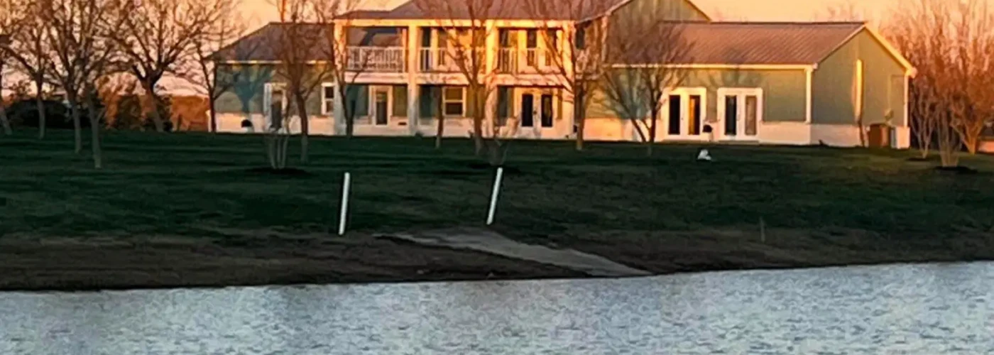 The Ranch house at Lake Serenity Ranch with stunning sunset and lake views